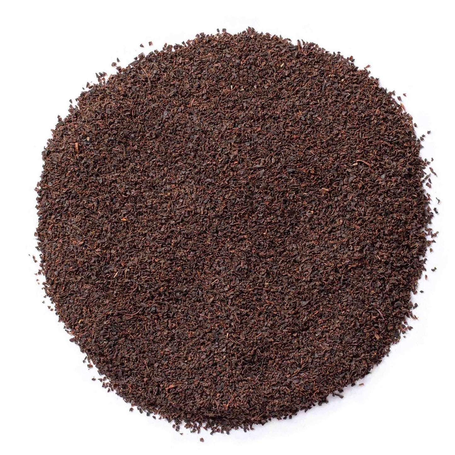 Close-up of decaffeinated Irish Breakfast Tea leaves on a white background