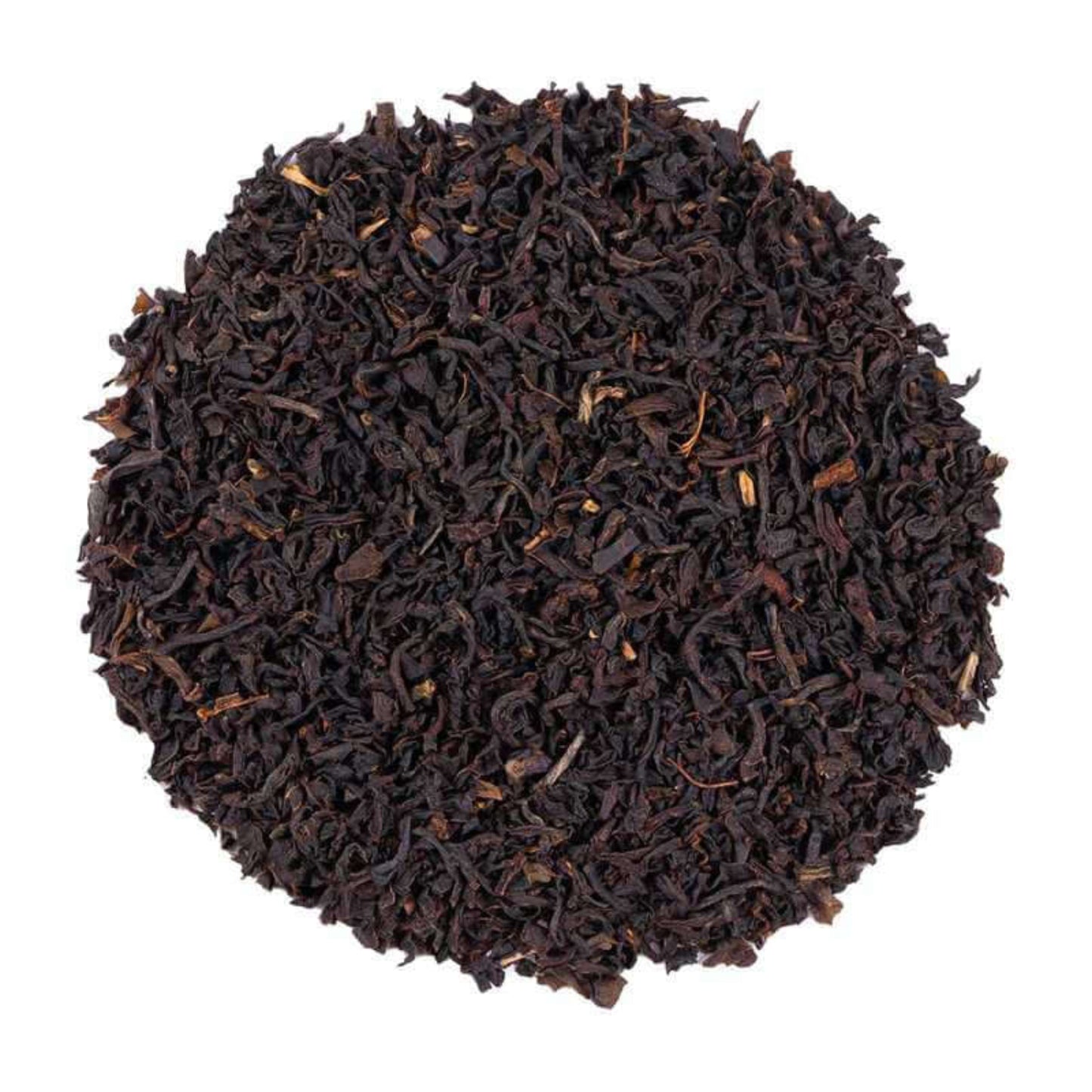 Close-up of English Breakfast Tea dark brown tea leaves on a white background