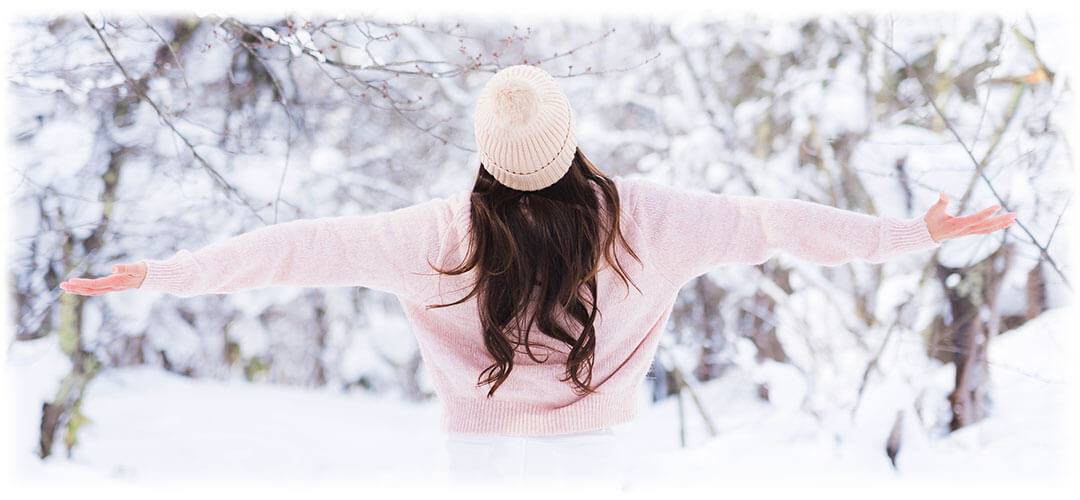 Lady outside in the winter celebrating the New Year