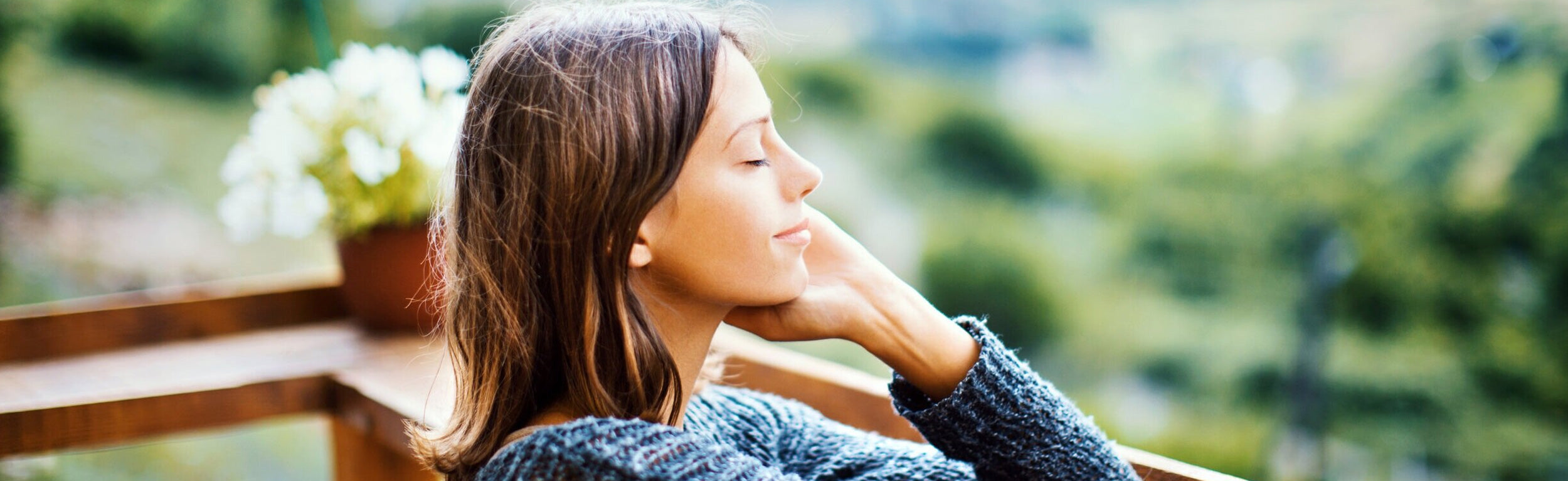 lady relaxing with hand up calming her senses