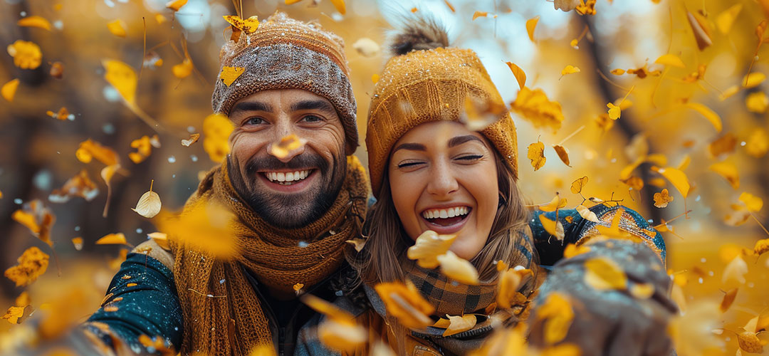 autumn couple enjoying the golden leaves