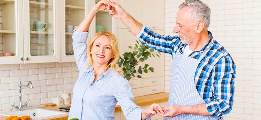 over 50s couple smiling as feeling great after taking supplements