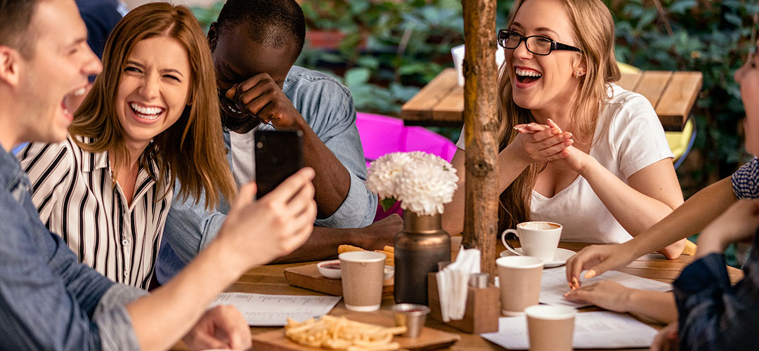 Group of friends enjoying a social gathering, with a focus on mindful choices and the growing trend of alcohol-free living