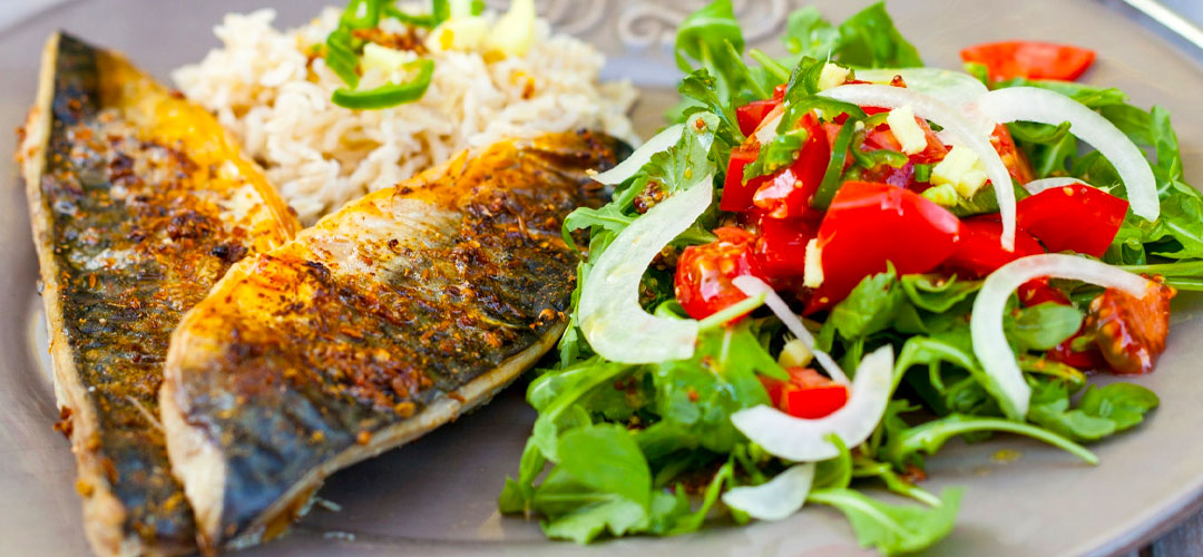 Fresh grilled Mackerel fillet with salad and rice