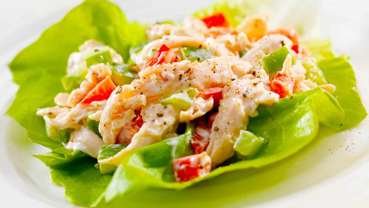 Chicken and avocado lettuce wraps with red pepper and fresh salad