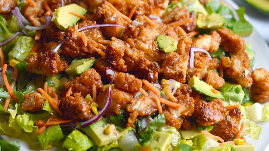 Chicken fajita salad with avocado, tomatoes, yoghurt and jalapeños
