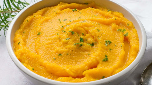 Creamy coconut carrot mash served in a bowl