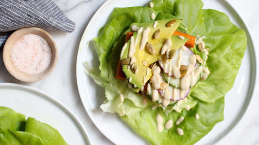 Lettuce wraps filled with feta, avocado, pine nuts and fresh vegetables