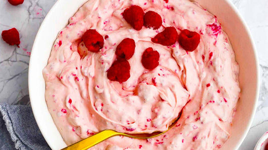 Creamy raspberry yoghurt whip topped with fresh raspberries