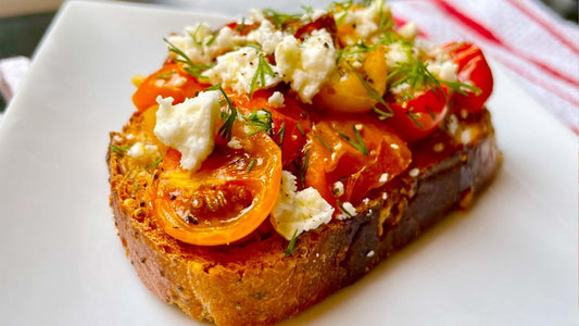 Grilled vine tomatoes and feta served on toasted bread