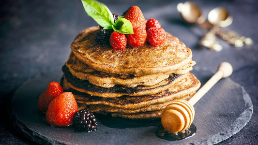 Banana chia pancakes topped with fresh berries