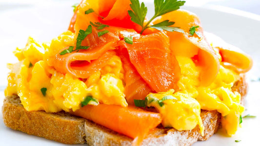 Smoked salmon and creamy scrambled eggs served on toasted rye bread.