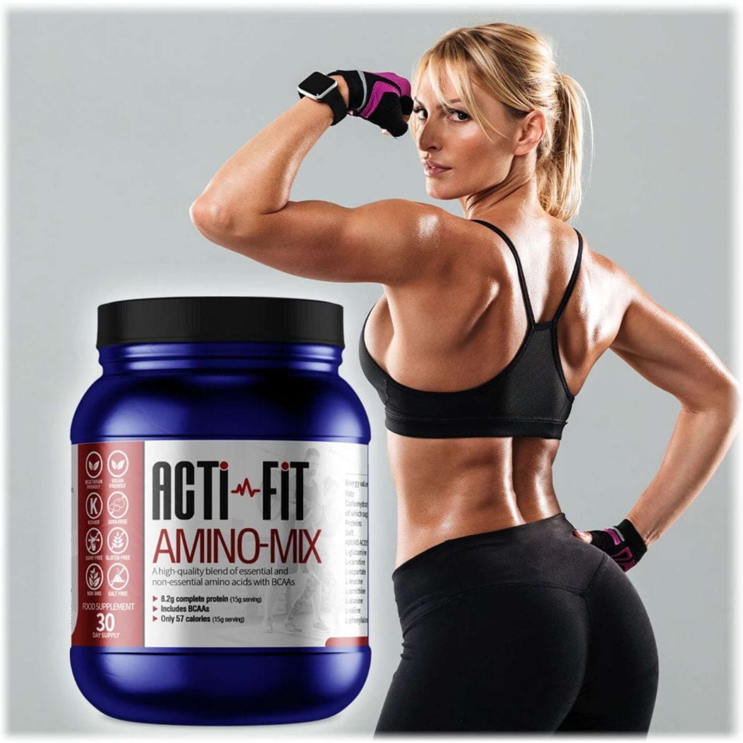 A woman in workout clothes flexing her biceps with a tub of Amino Mix in the foreground