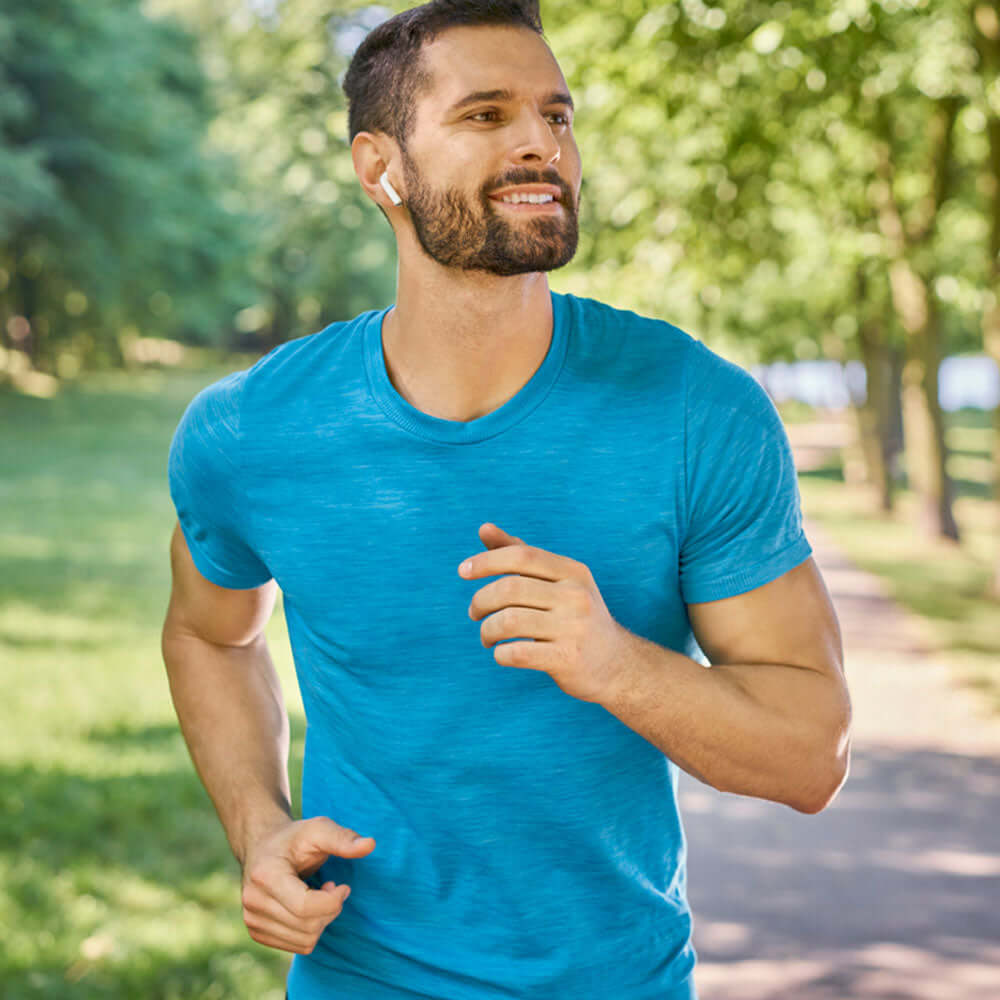 healthy male running in park