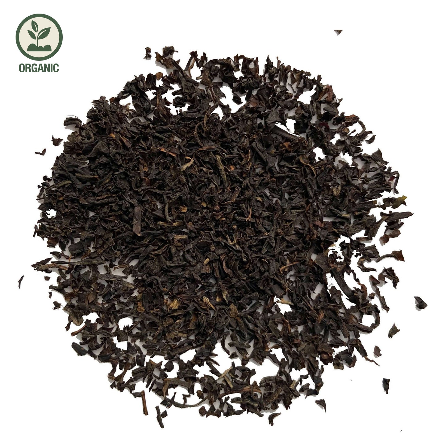 Close-up of loose-leaf Assam Sewpur Organic Black Tea, displaying the dried ingredients and natural texture of the blend.