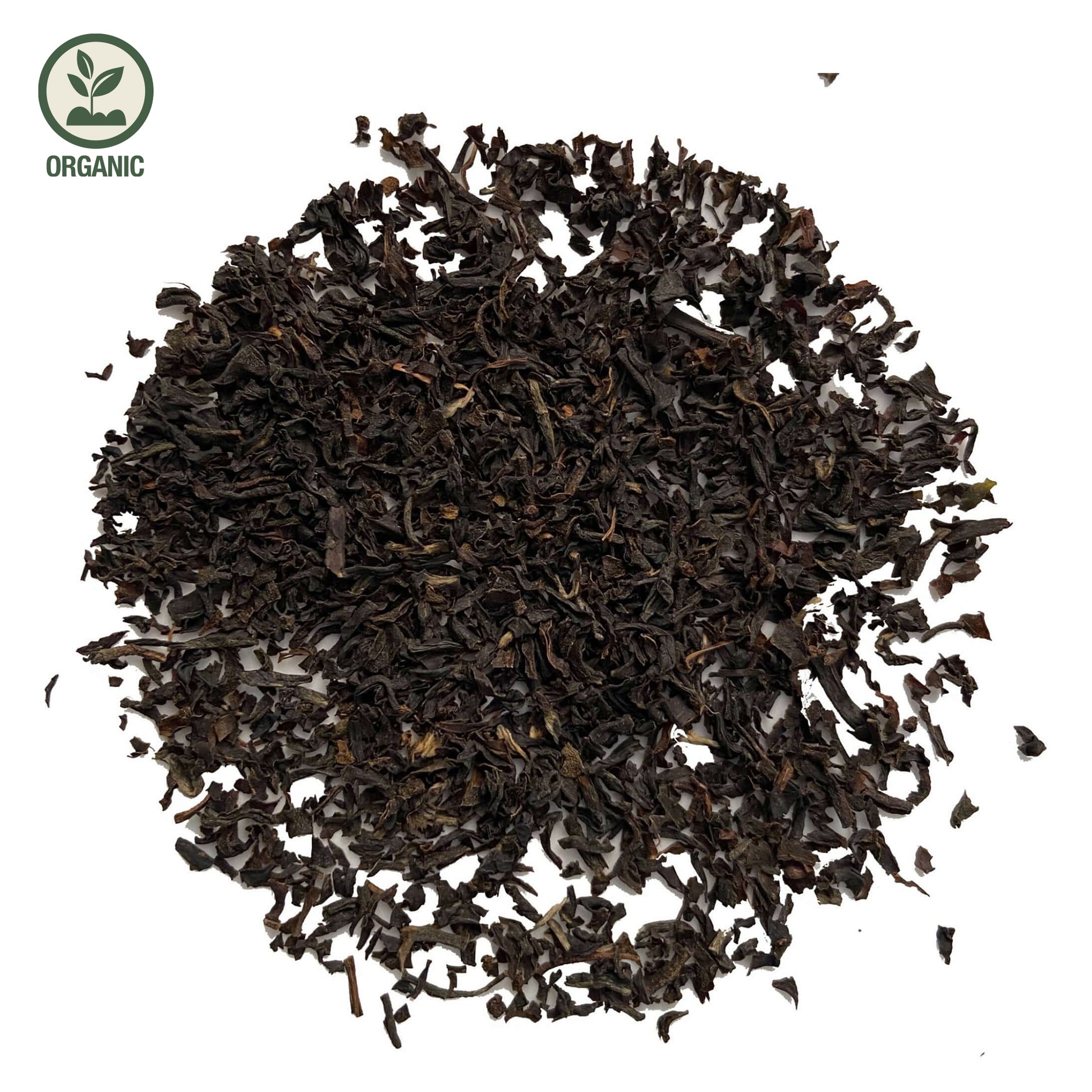 Close-up of loose-leaf Assam Sewpur Organic Black Tea, displaying the dried ingredients and natural texture of the blend.