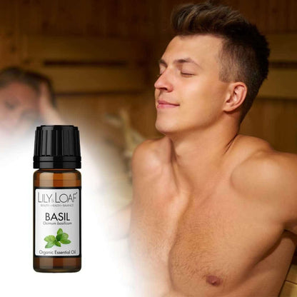 A man relaxing in a sauna with a bottle of Lily & Loaf Basil Organic Essential Oil