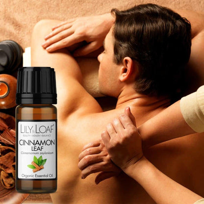 A man getting a back massage with a bottle of Lily & Loaf Cinnamon Leaf Organic Essential Oil