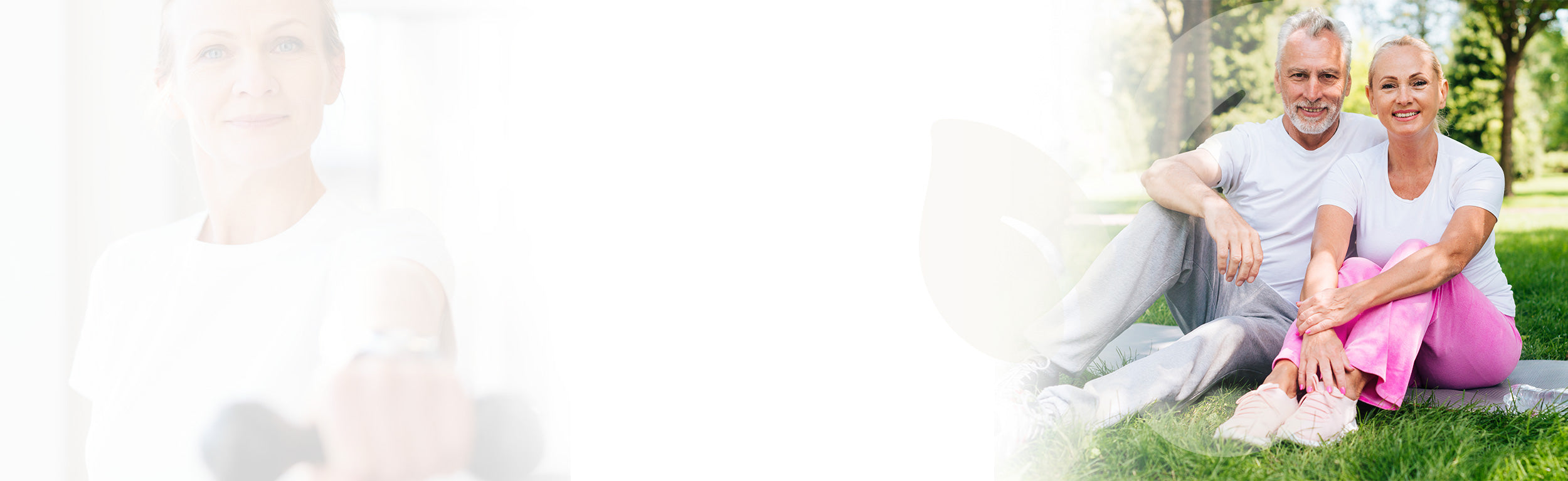 Two people sitting on a grassy area with a blurred background