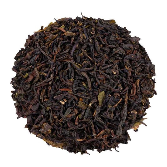 Close-up of loose-leaf Darjeeling Earl Grey Flavoured Tea, displaying the dried ingredients and natural texture of the blend.