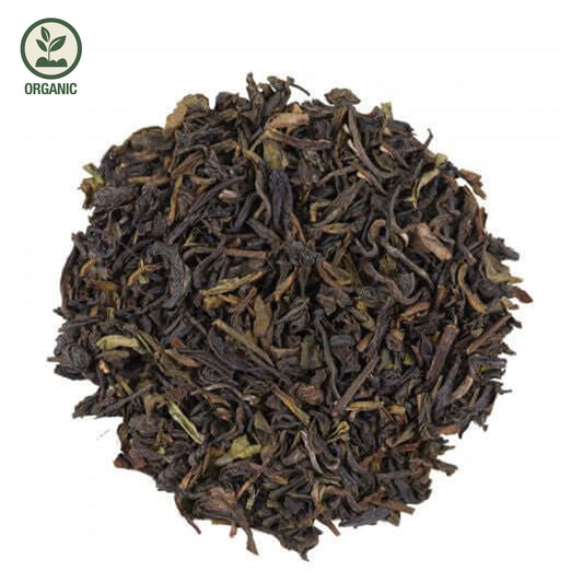 Close-up of loose-leaf Darjeeling Summer Organic Black Tea, displaying the dried ingredients and natural texture of the blend.