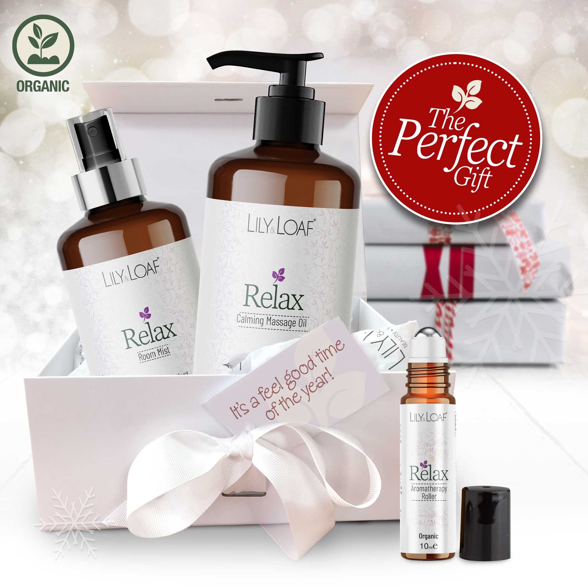 Lily & Loaf Relax Aromatherapy products with a gift box and decorative ribbon on a soft white background.