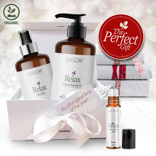 Lily & Loaf Relax Aromatherapy products with a gift box and decorative ribbon on a soft white background.