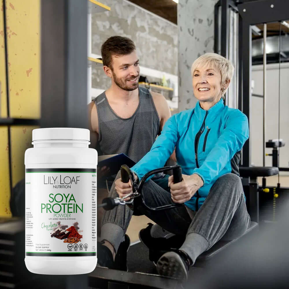 Lily & Loaf Soya Protein+ With Vitamins & Minerals - Middle aged lady using gym equipment with a personal trainer