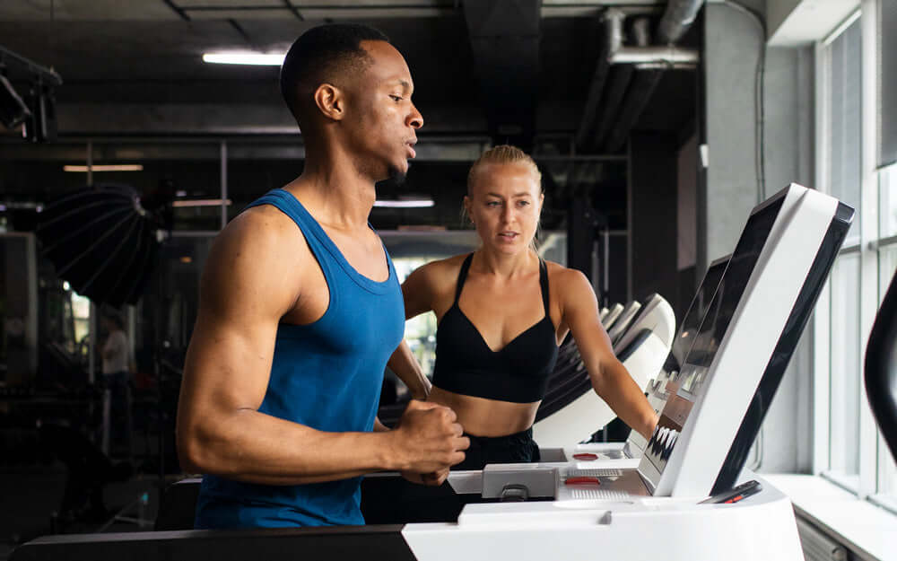 fitness exercises, male on treadmill with trainer