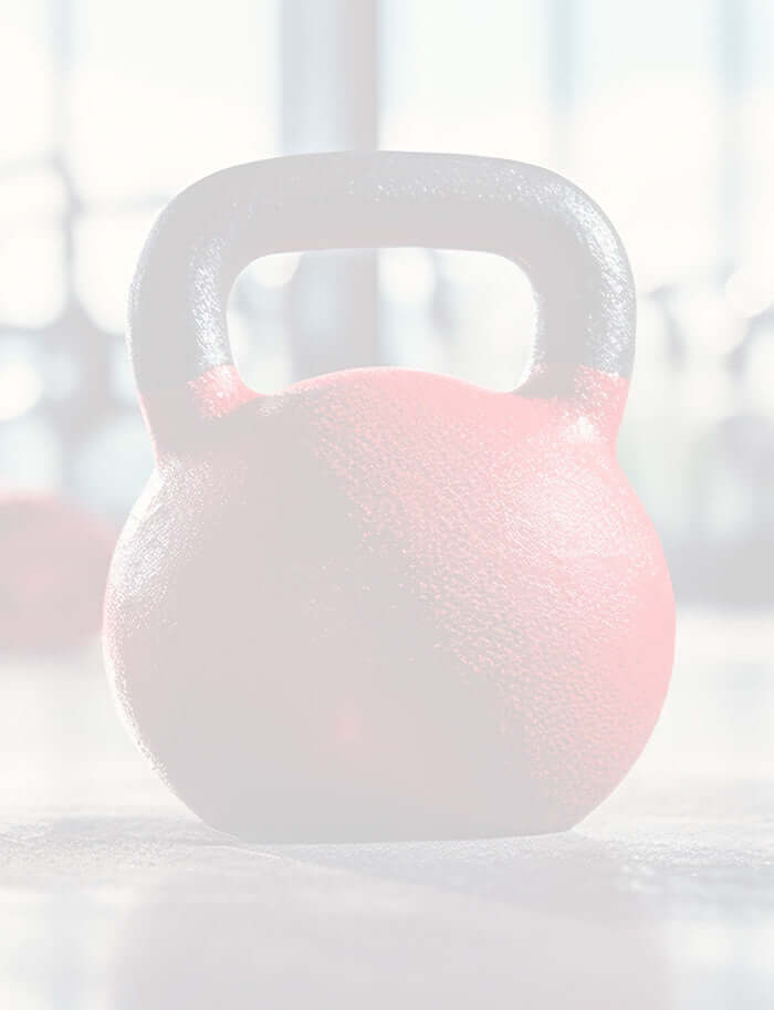 Red dumbbell on a gym floor