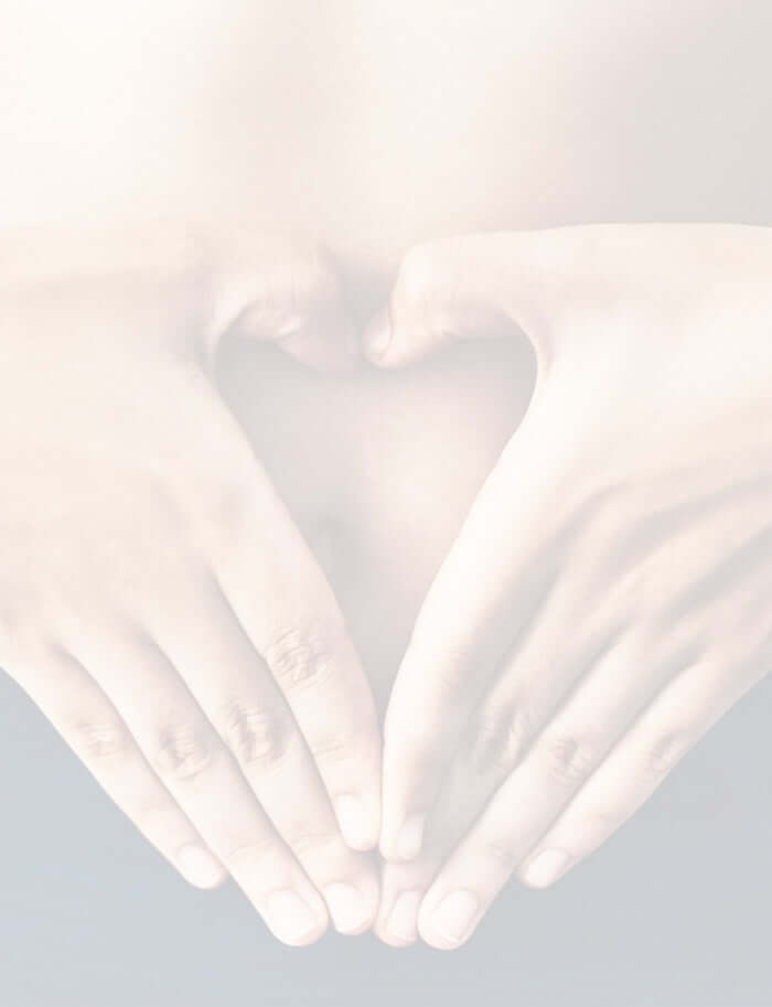 finger creating a heart shape on the tummy