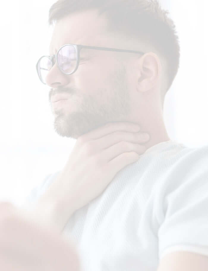 A man holding his neck due to swollen glands