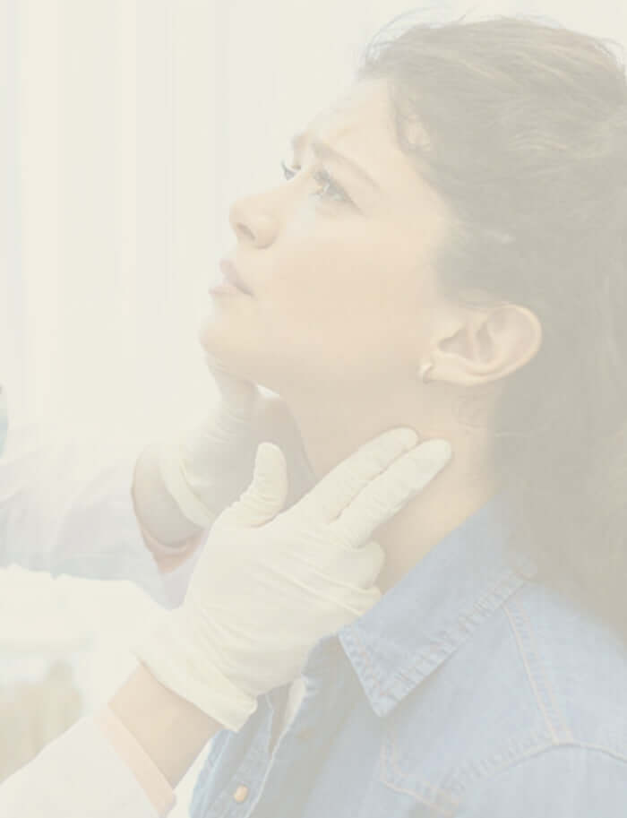 A woman having her glands checked