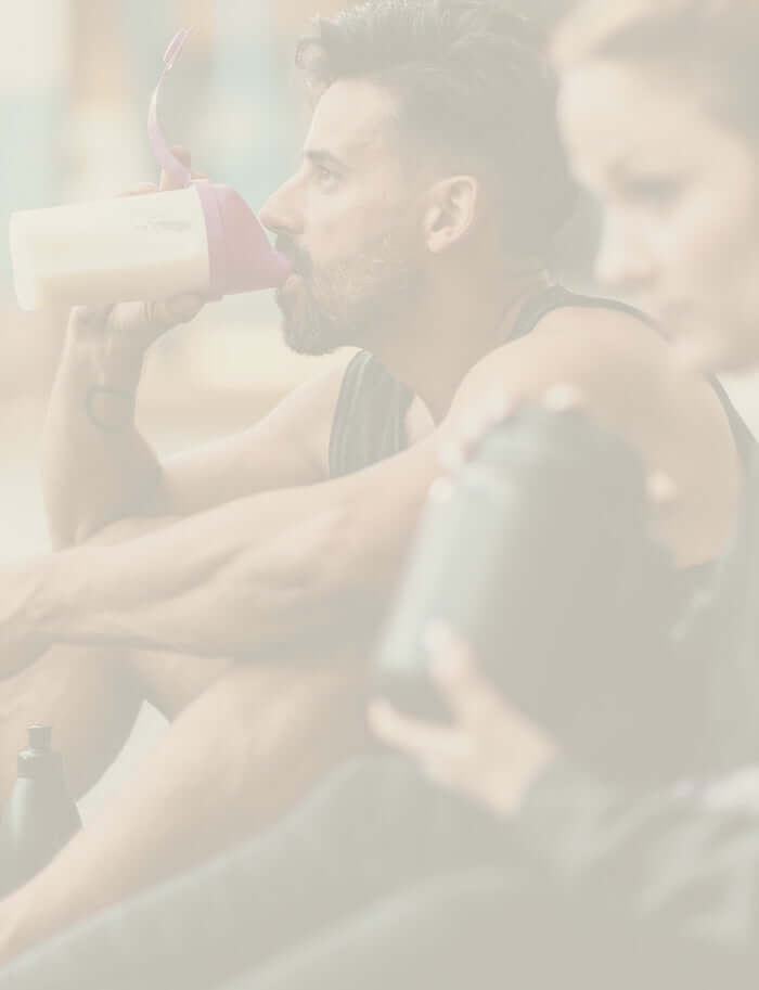 couple drinking protein after a workout