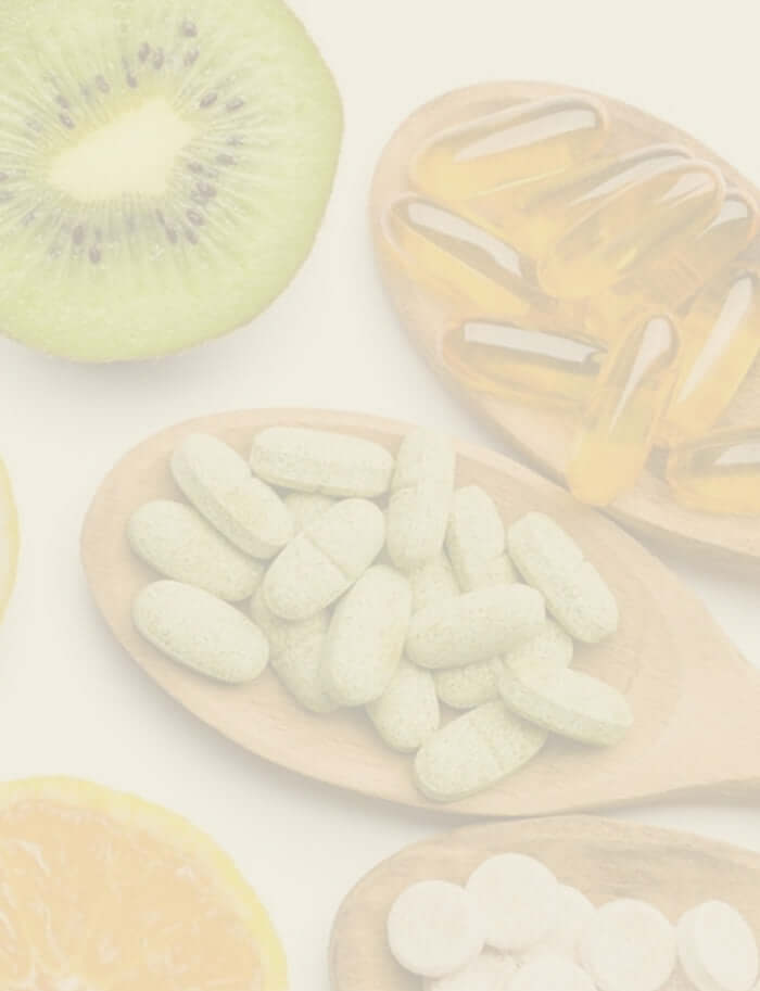 supplements and fruits laid out on a table