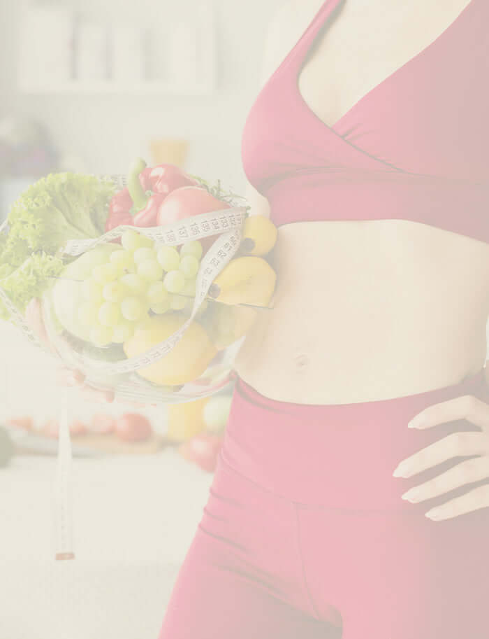 lady holding tape measure and fruit