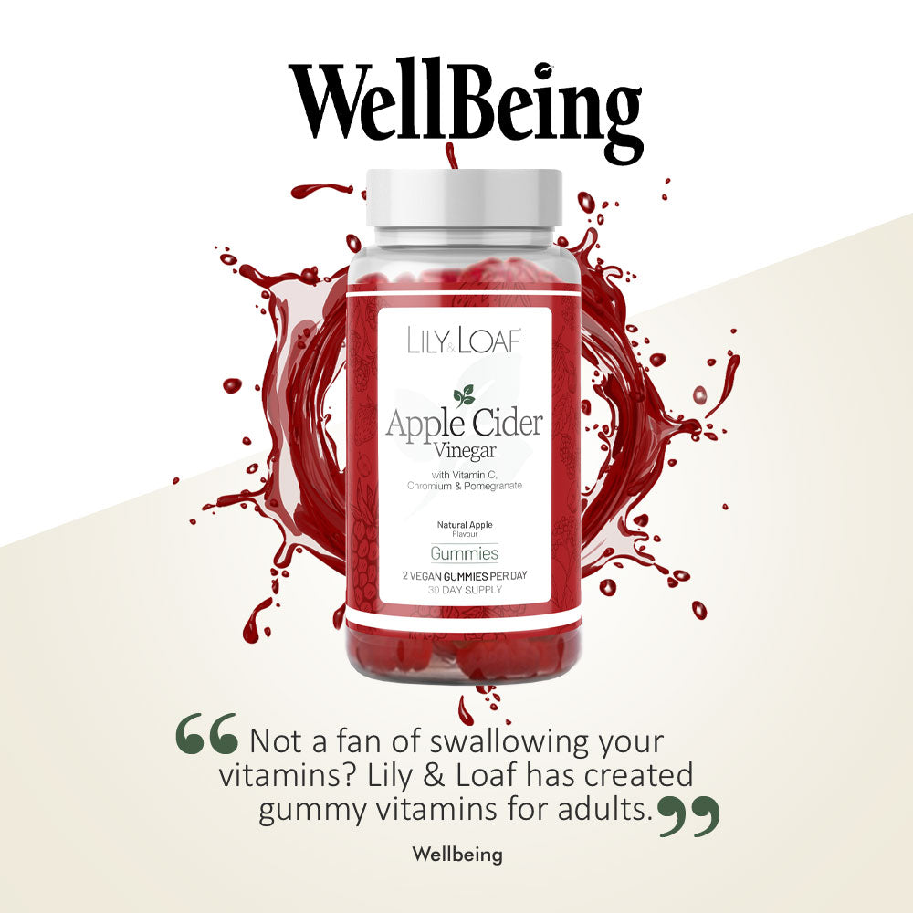 Wellbeing magazine feature of Lily & Loaf Apple Cider Vinegar gummies bottle with red apple splash on a neutral background