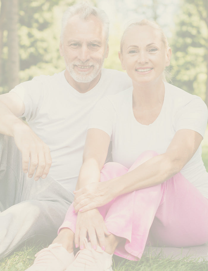 Two people sitting outdoors with a blurred background