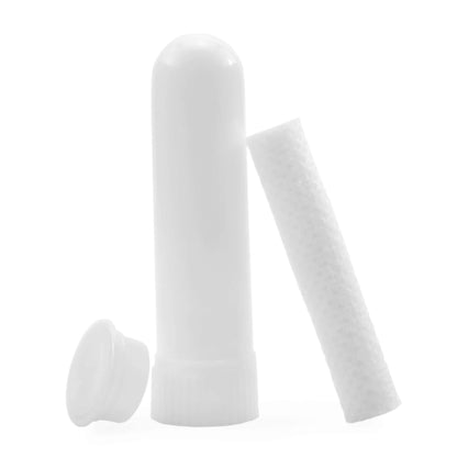 White nasal inhaler stick with cylindrical filter and lid on a white background