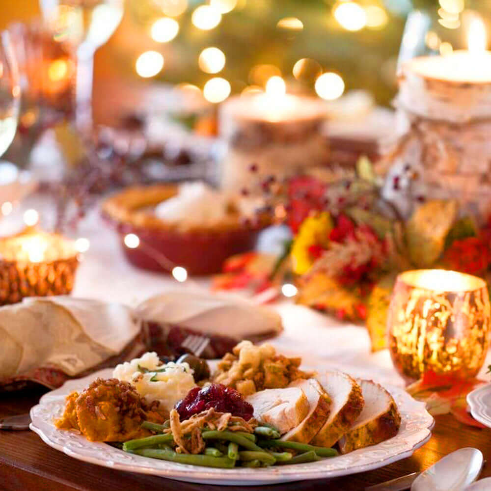 A delicious looking plate of Festive food on a Christmas decorated table