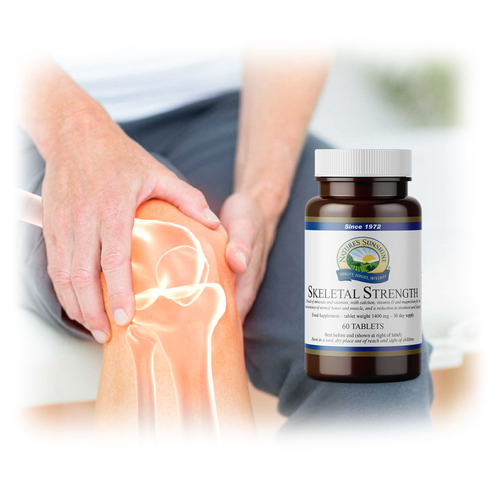 Person holding knee with highlighted joint pain beside Lily & Loaf's Skeletal Strength tablets.