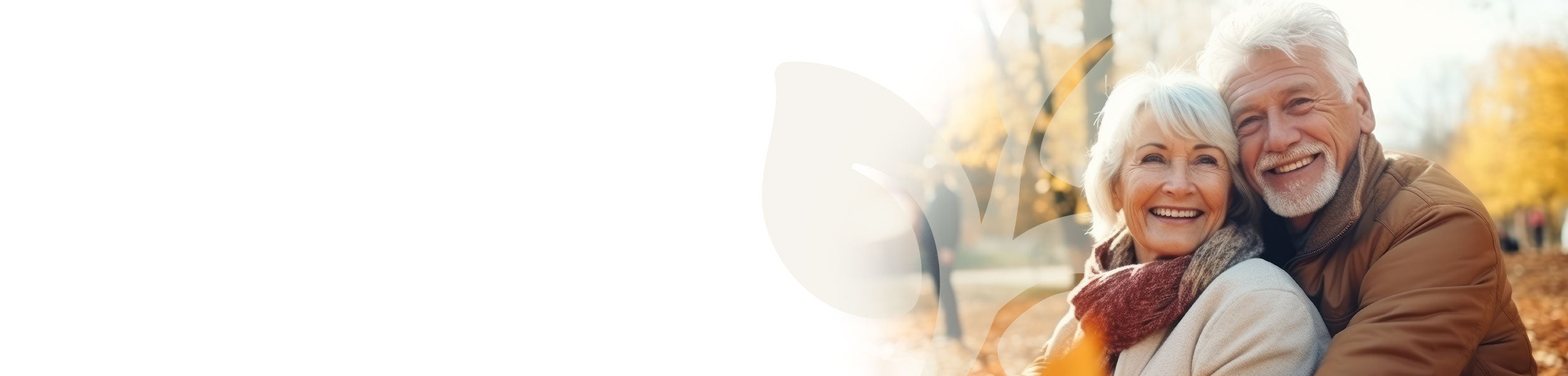 Senior couple embracing outdoors with a blurred autumn background