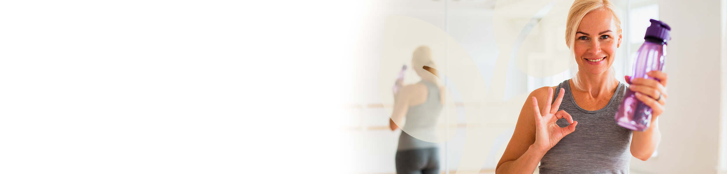 Woman holding a water bottle with a blurred background