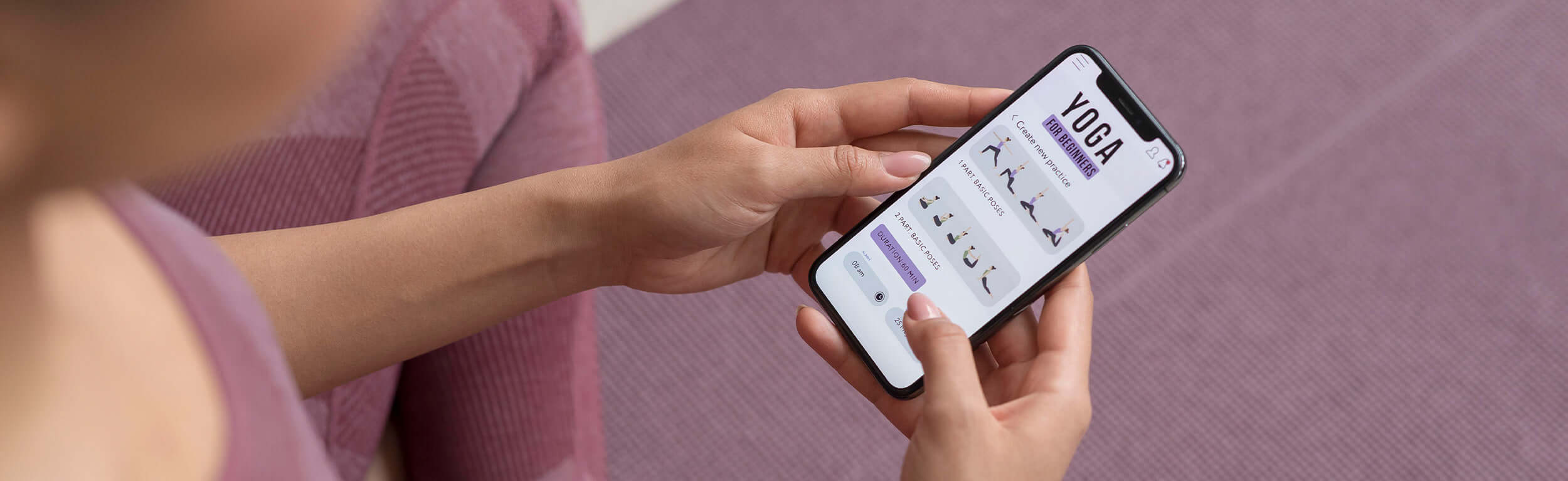 lady looking a yoga moves on a smart phone