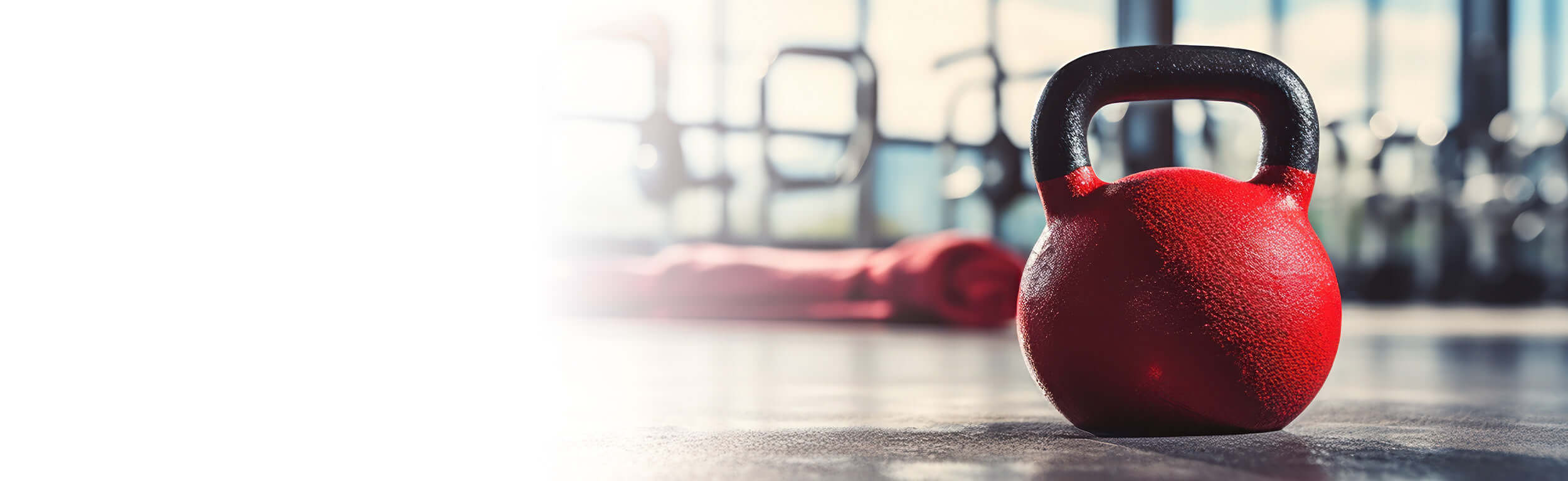 Red dumbbell on a gym floor