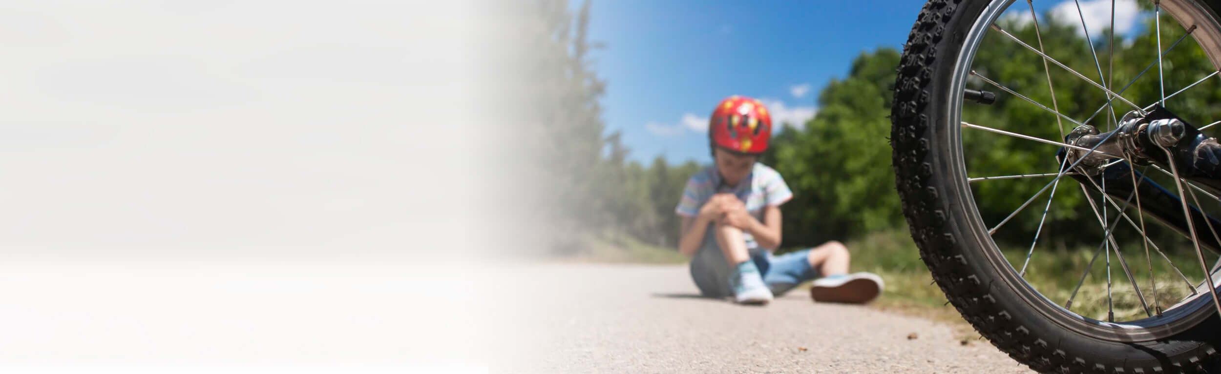 young boy fell of his bike