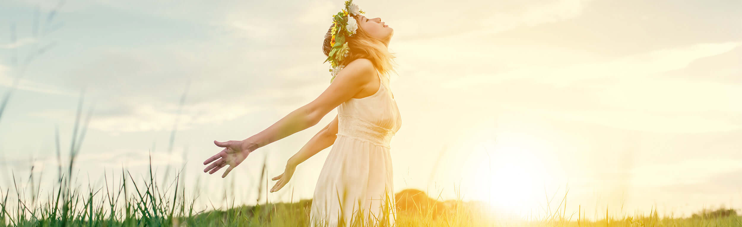 lady taking in the fresh air in a meadow