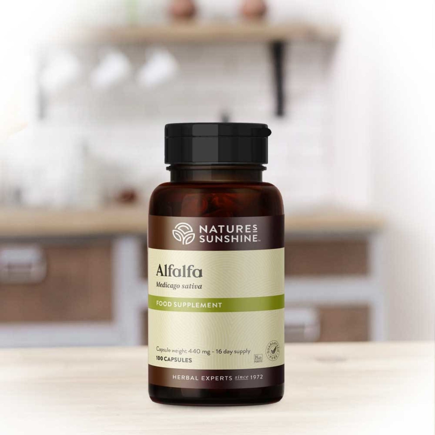 Alfalfa capsules from Nature's Sunshine shown on a kitchen table