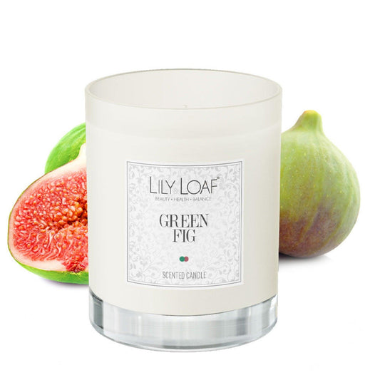 Lily & Loaf Green Fig Soy Wax Candle surrounded by green fig fruits highlighting the botanicals used in the candle