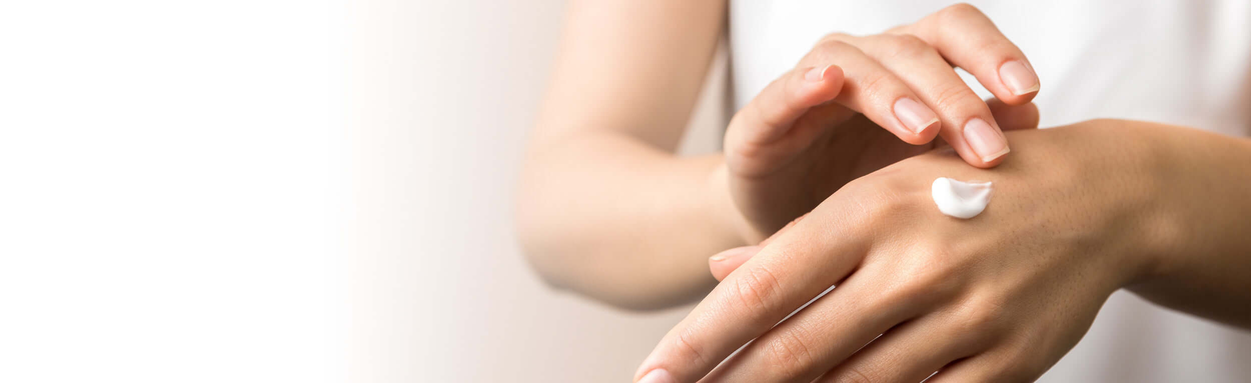 Luxury hand creams being massaged into hands